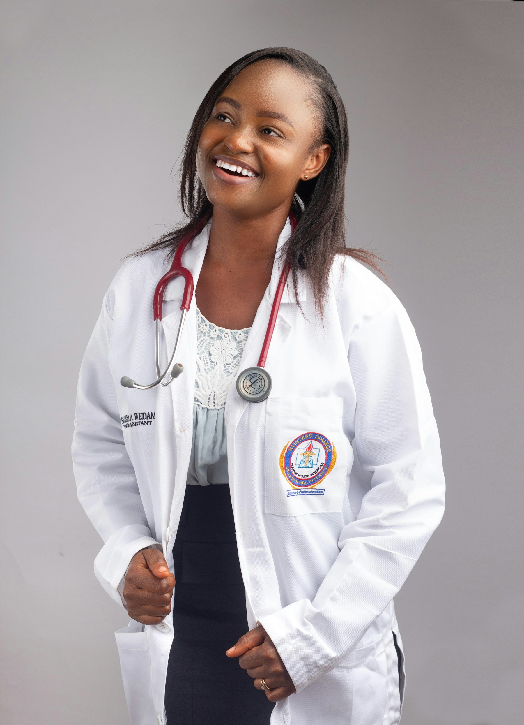A smiling doctor in a white coat with a stethoscope